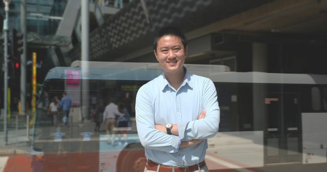 Yale Wong at bus stop