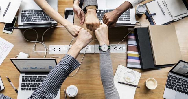 collaboration fist bumps