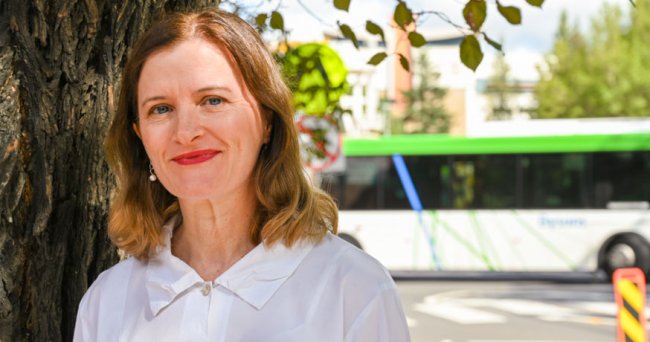 Marion Terrill, with bus in the background