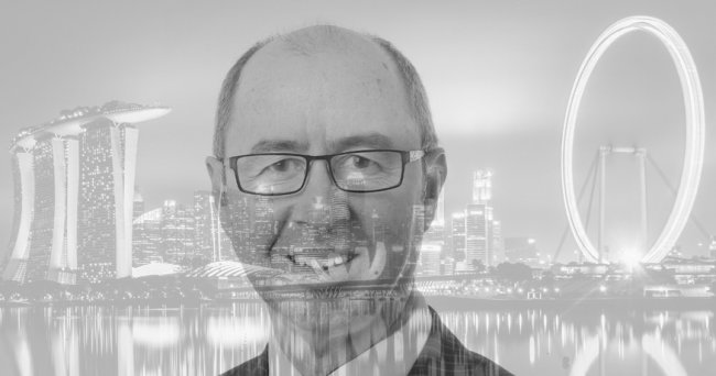 Tony Canavan with Singapore background