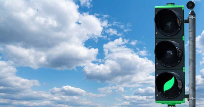 traffic light with green leaf symbol - transport decarbonisation